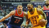 Cleveland Cavaliers forward LeBron James (right) drives to the basket against Washington Wizards forward Otto Porter Jr. during the first quarter of their NBA game at Verizon Center in Washington on Monday. 