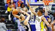 Manu Ginobili (left) of the San Antonio Spurs shoots the ball against the Indiana Pacers during their NBA game played at Bankers Life Fieldhouse on Monday in Indianapolis, Indiana. Spurs clinched their 20th straight winning season with a 110-106 win.