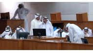 FILE PHOTO: Kuwaiti Electricity Water Minister Ahmad al-Jassar speaks as Oil Finance Minister Anas al-Saleh looks on during a session at the national assembly in Kuwait City on April 13, 2016 (AFP / YASSER AL-ZAYYAT) 