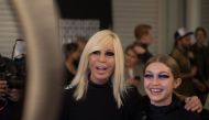 Italian fashion designer Donatella Versace and US model Gigi Hadid pose backstage before the Versus (Versace) catwalk show on the second day of the Autumn/Winter 2017 London Fashion Week in London on February 18, 2017. / AFP / Daniel LEAL-OLIVAS
