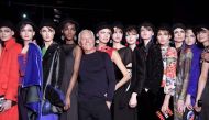 Italian designer Giorgio Armani (C) poses with models at the end of his show during the Women's Fall/Winter 2017/2018 fashion week in Milan, on February 27, 2017. / AFP / Tiziana FABI
