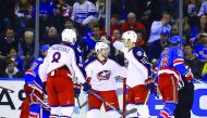 Columbus Blue Jackets' players celebrate a goal against the New York Rangers during their NHL game at Madison Square Garden in New York on Sunday. 