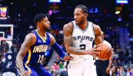 San Antonio Spurs' forward Kawhi Leonard (right) is defended by Indiana Pacers' forward Paul George during the first half of their NBA game in San Antonio on Wednesday. 