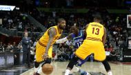 Cleveland Cavaliers guard Kyrie Irving (2) defended by Atlanta Hawks guard Dennis Schroder (17) as Cleveland Cavaliers center Tristan Thompson (13) sets a pick in the first quarter of they game at Philips Arena. Jason Getz