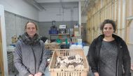 Lysiane Roy Maheu (L) and Dominique Lynch-Gauthier, co-founder of Montreal urban mushroom farming startup Blanc de Gris pose in the warehouse of the company on January 17, 2017 in Montreal, Quebec. AFP / Julien Besset