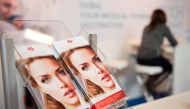 (FILES) This file photo taken on March 08, 2017 shows information material for plastic surgery displayed at a section for medical tourism at the International Tourism Trade Fair (ITB) on March 8, 2017. AFP / STEFFI LOOS 