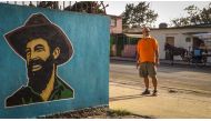 Cuban writer Leonardo Padura stands on a street of the Mantilla neighbourhood, Havana on February 7, 2017. AFP / Adalberto Roque