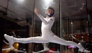 (FILES) This file photo taken on February 19, 2017 shows Maja Kuczynska, 17, making airborne gymnastic moves during her skydiving performance inside a wind tunnel in the Polish capital Warsaw on February 19, 2017. AFP / Janek Skarzynski 