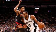 San Antonio Spurs small forward Kawhi Leonard (2) dribbles the ball as Atlanta Hawks small forward Kent Bazemore (left) defends during the second half at AT&T Center. Soobum Im