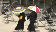 Women walk past an empty coffee shop in Riyadh, July 12, 2007. REUTERS/Ali Jarekji