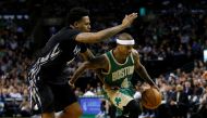 Boston Celtics point guard Isaiah Thomas (4) drives while guarded by Minnesota Timberwolves guard Brandon Rush (4) during the third quarter at TD Garden. The Boston Celtics won 117-104. Credit: Greg M. Cooper
