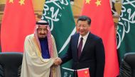 China's President Xi Jinping (R) and Saudi Arabia's King Salman bin Abdulaziz Al-Saud shake hands during a signing ceremony at the Great Hall of the People in Beijing, China March 16, 2017. REUTERS/Lintao Zhang/POOL
