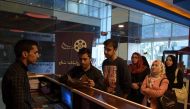 An Afghan family queue to buy tickets at the Galaxy Family Cinema in Kabul In this photograph taken on November 4 ,2016.  AFP / Shah Marai