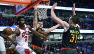 Chicago Bulls forward Jimmy Butler (left) in action against Atlanta Hawks forward Mike Muscala (right) during the first quarter of their NBA game in Chicago on Saturday. 