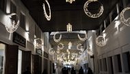 Bahrainis walk near the shops at the old Manama market late on June 10, 2016 during Ramadan (AFP / Mohammed Al-Shaikh) 