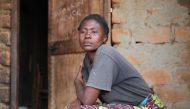 Tanzanian widow Rosemary Cyprian poses after an interview outside her home on Ukerewe Island on on 24 February 2017. TRF/Katy Migiro