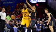 LeBron James #23 of the Cleveland Cavaliers looks for a pass while under pressure from DeAndre' Bembry #95 of the Atlanta Hawks during the second half at Quicken Loans Arena on April 7, 2017 in Cleveland, Ohio.   Jason Miller/Getty Images/AFP
