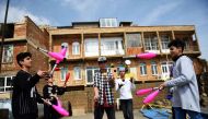 Syrian boys juggle on a roof of a building on March 19, 2017, in Mardin. Some children are perched on stilts, others are spinning plates or happily performing aerial dances. But this is not the big top circus in a major city but a house in southeastern Tu