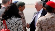 U.S. Defense Secretary James Mattis (C-R) is greeted by Saudi Armed Forces Chief of Joint Staff General Abdul Rahman Al Banyan (C-L) upon his arrival at the Riyadh Air Base on April 18, 2017 at the start of a Middle East tour. / AFP / POOL / JONATHAN ERNS