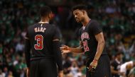 Jimmy Butler #21 of the Chicago Bulls talks with Dwyane Wade #3 during the third quarter of Game Two of the Eastern Conference Quarterfinals against the Boston Celtics at TD Garden on April 18, 2017 in Boston, Massachusetts.  Maddie Meyer/AFP
