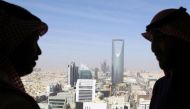 File Photo: Men look out of a building as the Kingdom Centre Tower is seen in Riyadh, Saudi Arabia, January 1, 2017. Reuters/Faisal Al Nasser/File Photo
