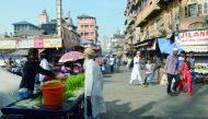 This photo taken on December 2, 2016 shows members of the Dawoodi Bohra community in the Bhendi Bazaar area of Mumbai, which is being redeveloped under the Cluster Development Act 2009 by the Saifee Burhani Upliftment Trust. AFP / Indranil Mukherjee