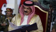 Bahrain's King Hamad bin Isa al-Khalifa reads the schedule of events during the official inauguration ceremony of the King Hamad Hospital in Muharraq, north of Manama February 6, 2012. REUTERS/Hamad I Mohammed