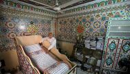 Saad Mohammed rolls down what he says is the largest handwritten version of Koran in the world measuring around 700 meters long, the town of Belqina, north of Cairo, Egypt, April 26, 2017. Picture taken April 26, 2017. REUTERS/Mohamed Abd El Ghany