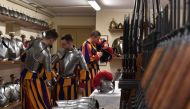 New Vatican Swiss Guards put on and adjust their uniforms prior to a swearing-in ceremony in Vatican City, on May 6, 2017. The annual swearing in ceremony for the new papal Swiss guards takes place on May 6, commemorating the 147 who died defending Pope C