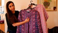 Palestinian fashion designer Natalie Tahhan displays some of her creations at her studio in the east Jerusalem neighbourhood of Ras al-Amud on April 13, 2017. AFP / AHMAD GHARABLI
