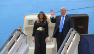 US President Donald Trump and First Lady Melania Trump step off Air Force One upon arrival at King Khalid International Airport in Riyadh on May 20, 2017. AFP / MANDEL NGAN
