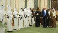 The Custodian of the Two Holy Mosques, King Salman bin Abdulaziz Al Saud of Saudi Arabia (R) welcomes U.S. President Donald Trump (right 2) and his wife Melania Trump (right 3) prior to their meeting at Al-Yamamah Palace in Riyadh, Saudi Arabia on May 20,