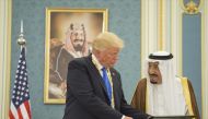 The Custodian of the Two Holy Mosques, Saudi Arabia's King Salman bin Abdulaziz Al Saud (R) presents state medal to U.S. President Donald Trump (L) at Al-Yamamah Palace in Riyadh, Saudi Arabia on May 20, 2017. (Bandar Algaloud / Saudi Royal Council / Hand