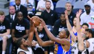 Kevin Durant (centre) of the Golden State Warriors drives to the basket against the San Antonio Spurs in the second half during Game Three of their 2017 NBA Western Conference Finals at AT&T Center on Saturday in San Antonio, Texas.