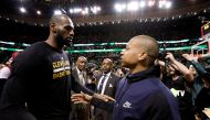 Cleveland Cavaliers forward LeBron James (23) and Boston Celtics guard Isaiah Thomas (4) meet after game five of the Eastern conference finals of the NBA Playoffs at the TD Garden. Greg M. Cooper