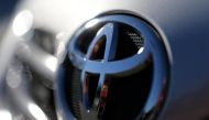 The Toyota logo is seen on a car in a park lot in Sao Paulo, Brazil June 2, 2017. REUTERS/Paulo Whitaker.