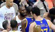 LeBron James #23 of the Cleveland Cavaliers and Kevin Durant #35 of the Golden State Warriors speak after a foul in the third quarter in Game 4 of the 2017 NBA Finals at Quicken Loans Arena on June 9, 2017 in Cleveland, Ohio. AFP Jason Miller
