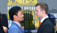 Boxers Manny Pacquiao (left) of the Philippines and Australia's Jeff Horn stand together following their official news conference ahead of their WBO welterweight fight in Brisbane, Australia yesterday. 