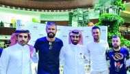 Sergio Busquets, Jordi Alba, and Gerard Pique with fans at Mall of Qatar. 
