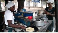 Women preparing dishes in Dar Es Salaam in this video grab dated Jun 19, 2013 (Photo courtesy: Frank Starmer / YouTube)  