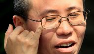  Liu Xia, wife of veteran Chinese pro-democracy activist Liu Xiaobo, wipes her eyes as she speaks during an interview in Beijing June 24, 2009. REUTERS/David Gray/File Photo