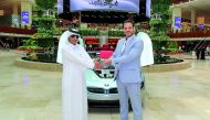 Hassan Ahmad Al Marri, the winner of Mall of Qatar’s (MOQ) ‘Shop and Win’, receiving the keys of BMW i8 from Rony Mourani, General Manager of MOQ. 