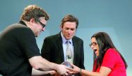 Reid Hoffman (L), co-founder of LinkedIn, presents the inaugural Disobedience Award to Virginia Tech engineering Professor Marc Edwards (C) and Dr. Mona Hanna-Attisha of Michigan's Hurley Medical Center, who first drew national attention to the water cris