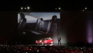 Tesla Chief Executive Elon Musk introduces one of the first Model 3 cars off the Fremont factory's production line during an event at the company's facilities in Fremont, California, US, July 28, 2017. (REUTERS/Alexandria Sage)