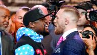 Floyd Mayweather Jr. (left) and Conor McGregor stand face to face during the Floyd Mayweather Jr. vs Conor McGregor World Press Tour at Staples Center in Los Angeles, in this July 12, 2017 file photo. 