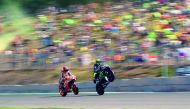 Repsol Honda Team’s Spanish rider Marc Marquez (left) and Movistar Yamaha MotoGP Italian rider Valentino Rossi make wheelies during the qualifying round of the MotoGP Grand Prix of the Czech Republic in Brno yesterday.