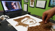 Artist Abdelrahman al-Habrouk creates a portrait of the actor Johnny Depp with tobacco in Alexandria, Egypt August 10, 2017. Picture taken August 10, 2017. Reuters/Mohamed Abd El Ghany