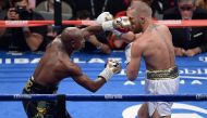 Floyd Mayweather Jr (black trunks) and Conor McGregor (white trunks) box during their boxing match at T-Mobile Arena. Mayweather won via tenth round TKO. (Joe Camporeale-USA TODAY Sports)