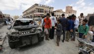 Yemenis inspect the site of a Saudi-led airstrike on a bridge two people were killed and three injured, Sanaa, Yemen, March 23, 2016.  (EPA Yahya Arhab) 