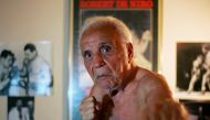 Former middleweight boxing champion Jake LaMotta poses in New York October 28, 2009. LaMotta learned to fight with an ice pick in his hand in a Bronx schoolyard, battering all the way in later life to a world middleweight title in an era of 15-round fight